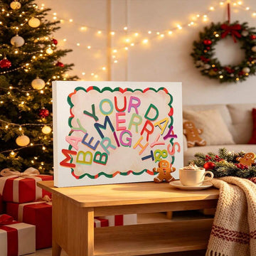 Merry and Bright colorful Christmas canvas poster beside a decorated tree and wrapped gifts