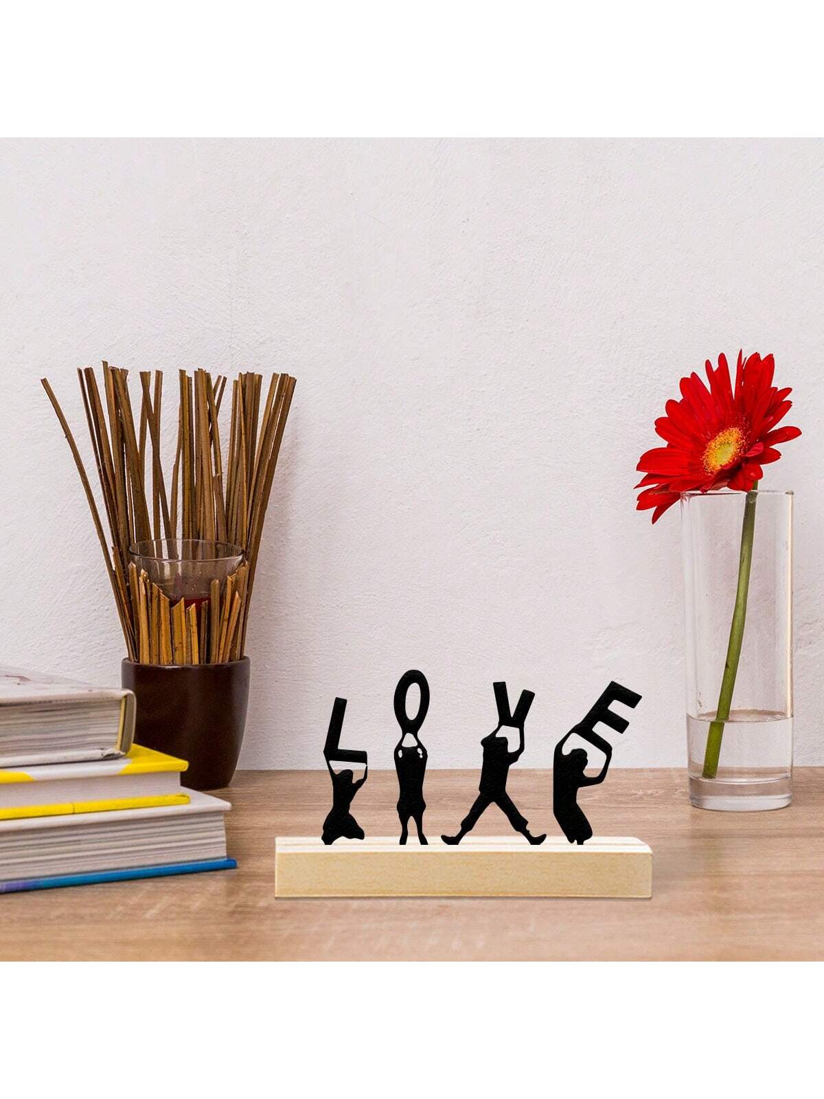 Create a unique and modern atmosphere in your home or office with this Metal LOVE Art Sculpture. Made from high-quality iron, this figurine adds a touch of elegance and sophistication to any room. Its sleek design and sturdy construction make it a perfect addition to your decor.