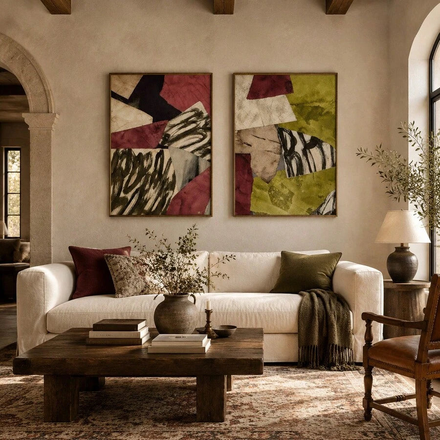 Two abstract collage posters in olive and burgundy above a cream sofa