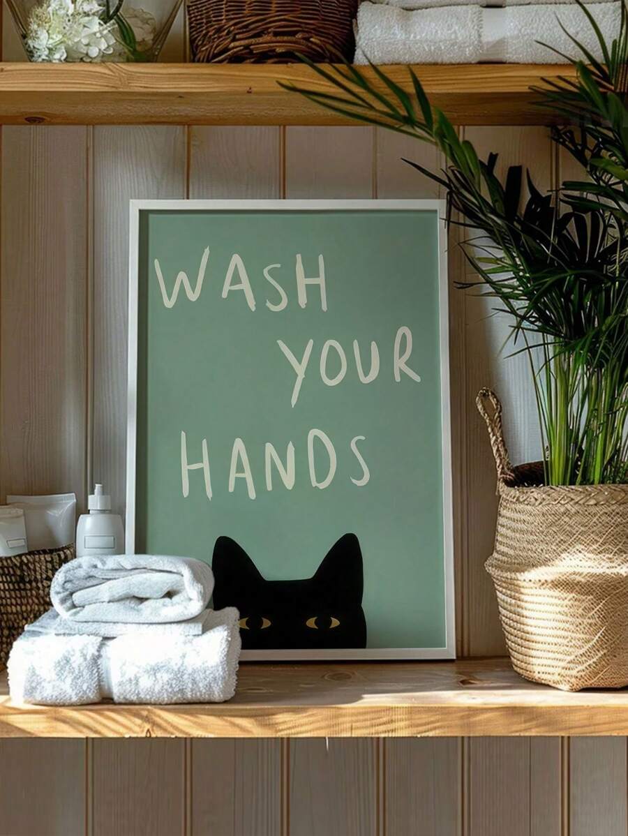 Sage green WASH YOUR HANDS cat canvas styled on bathroom shelf with towels and plant
