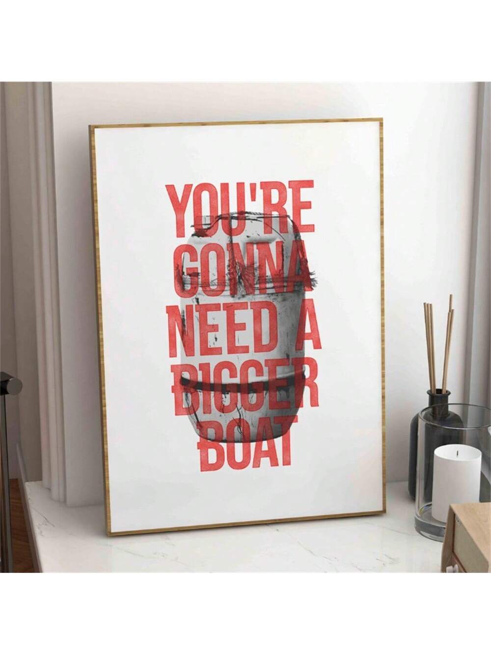 This minimalist canvas print features the iconic phrase "You'll Need A Bigger Boat" from the classic Jaws movie, making it a sophisticated addition to any home decor. Its clean design captures the essence of the film without overwhelming your space, offering a subtle yet impactful statement piece. Perfect for movie enthusiasts and modern interiors alike, this wall art blends cinematic nostalgia with contemporary style.