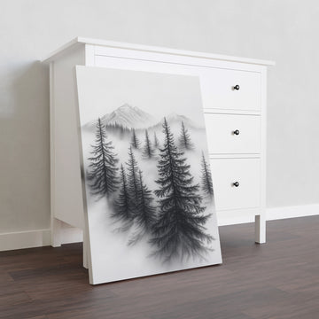 Transform your living room, bedside, or sofa backdrop into a tranquil retreat with this stunning Misty Forest Canvas Wall Art. Featuring a black and white depiction of pine trees against majestic mountains, this piece adds a sense of serenity to any space. Made with high-quality materials, it will enhance your home decor for years to come.
