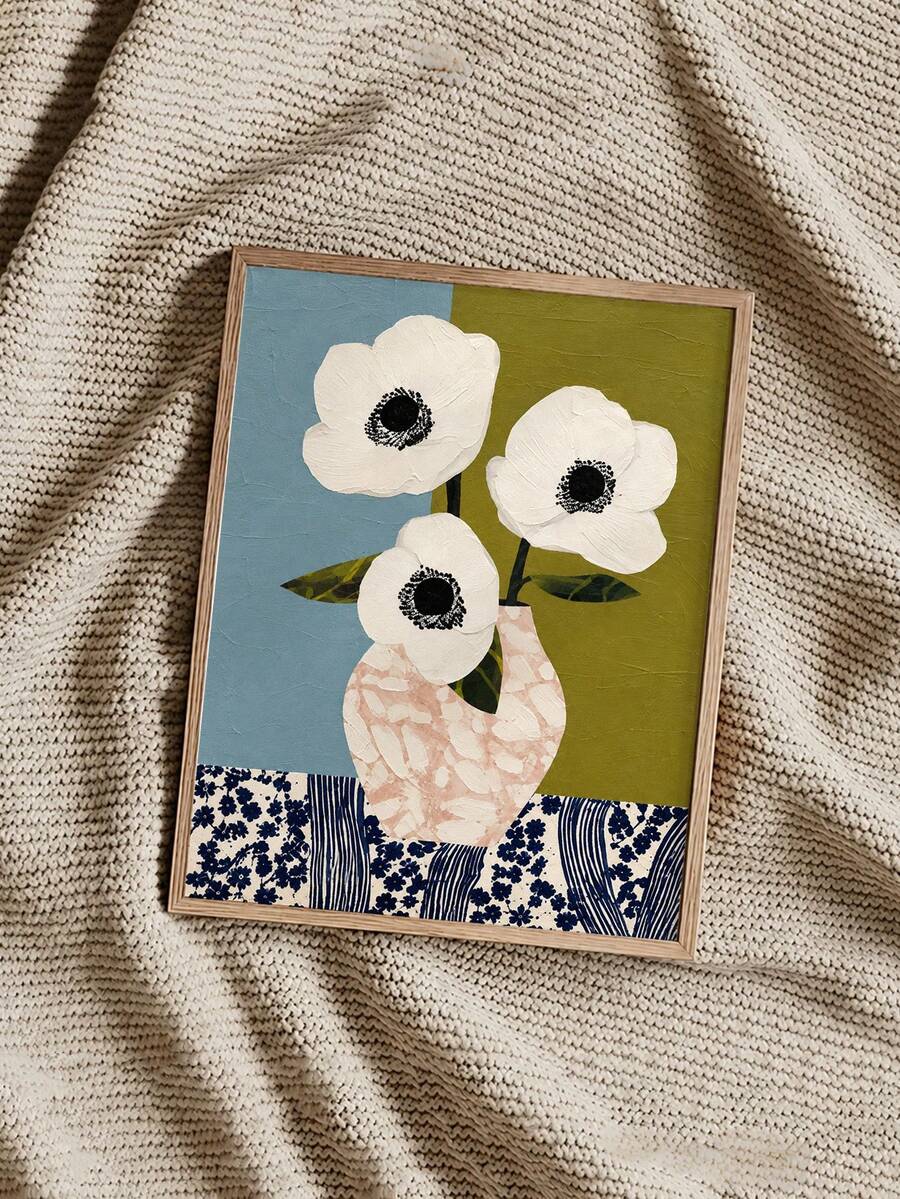 Three white anemones in a blush vase against blue and olive panels with navy floral border