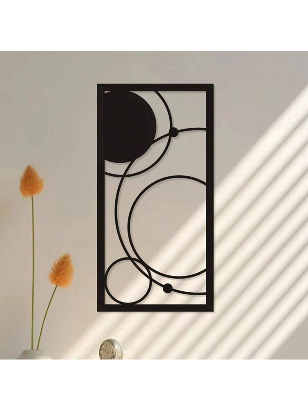 This modern black geometric metal wall art adds a touch of sophistication to any interior. Designed with minimalist abstract patterns, this piece is a perfect statement piece for a chic and elegant home. Its sturdy metal construction also ensures durability and longevity. Elevate your home decor with this unique and stylish wall art.