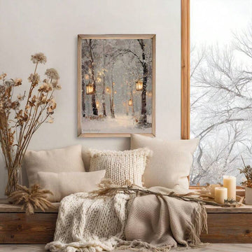 Snowy forest lantern canvas print above knit cushions in a neutral winter window nook