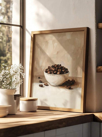 Moody coffee bean still life poster leaning on sunlit kitchen counter by window