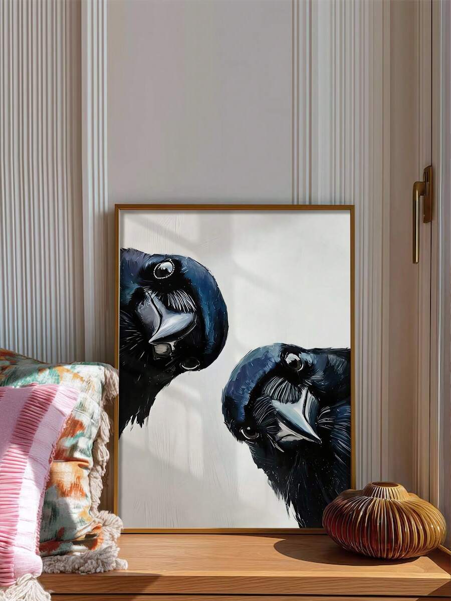 Framed raven and crow canvas wall art styled on a wooden console with a colorful throw