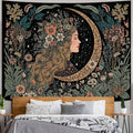 Moon girl floral tapestry displayed above bedroom bed