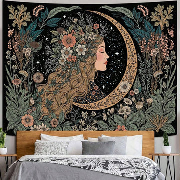 Moon girl floral tapestry displayed above bedroom bed