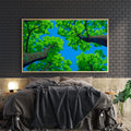 Bring serene natural beauty into your home with this captivating canvas wall art. Featuring lush green tree branches gracefully set against a tranquil blue sky, this piece creates an instant focal point that transforms any room. The calming color palette and organic composition make it ideal for living rooms, bedrooms, or above sofas, promoting relaxation and visual interest.