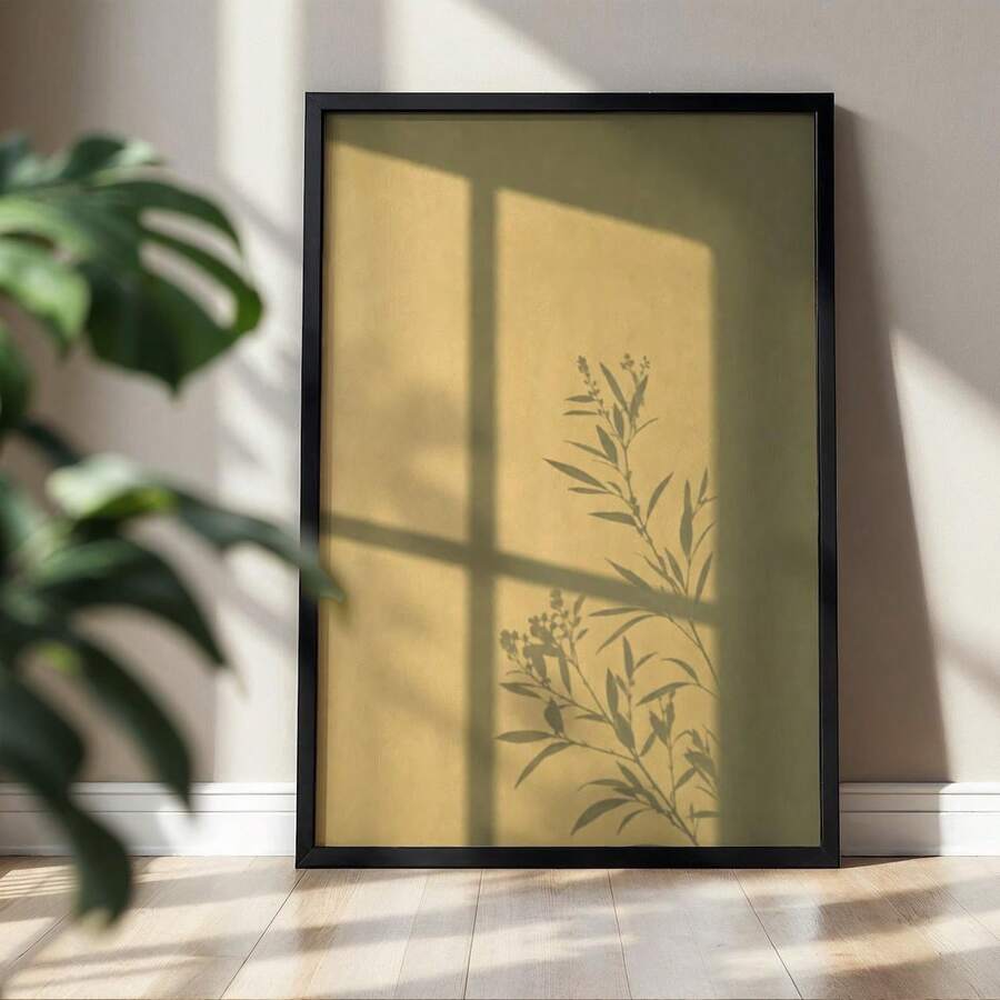 Botanical branch silhouette canvas print in olive ochre and black above a neutral sunlit wall