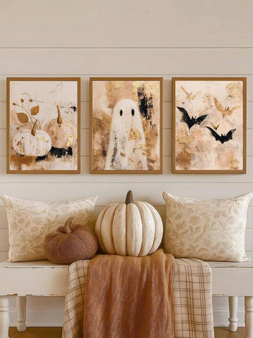 Framed pumpkin ghost and bat Halloween art trio above a bench