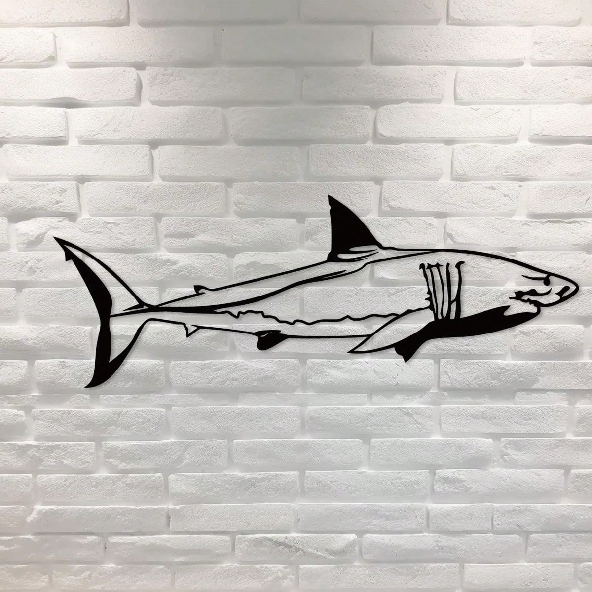 Unleash the power of the ocean with our Ocean Ruler Shark Metal Wall Decor. This ferocious addition to your home will make a bold statement while adding a touch of marine life to your space. Crafted with high-quality metal, this piece is both durable and stunning.