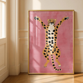 Leopard wall art with spotted cat figure raising arms on bright pink background