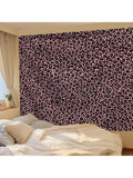 Pink leopard print tapestry with black spots shown as bold bedroom wall decor