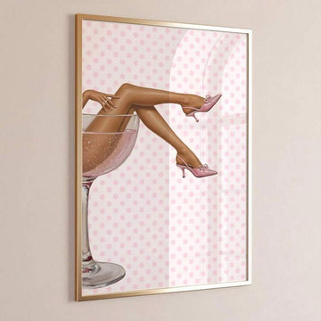 Pink martini and polka-dot heel fashion canvas poster in a gold frame on a beige wall