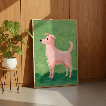 Framed pink dog wall art on green background styled in warm living room corner