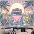 Pink surf van beach tapestry displayed above black living room sofa