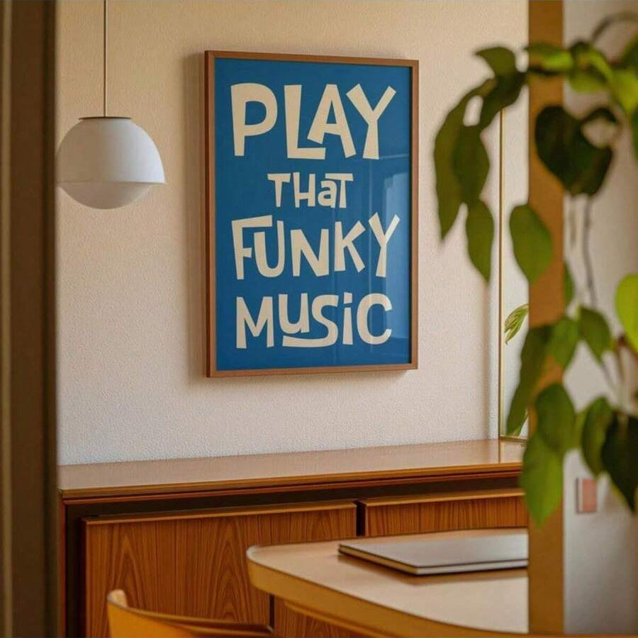 Blue Play That Funky Music poster above walnut dining cabinet and plant
