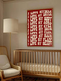 Red nursery affirmation poster above crib with self love message in cream letters