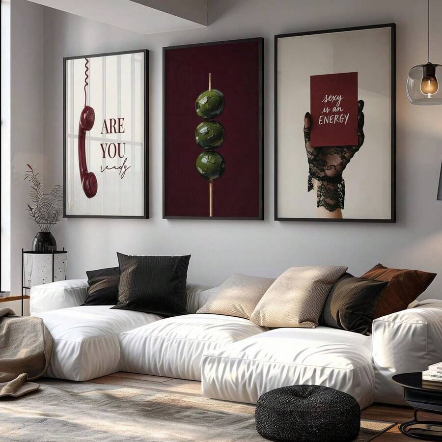 Burgundy vintage phone olive and lace glove triptych above a white living room sofa