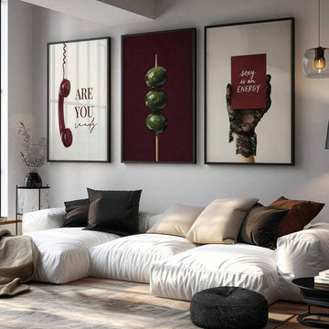 Burgundy vintage phone olive and lace glove triptych above a white living room sofa