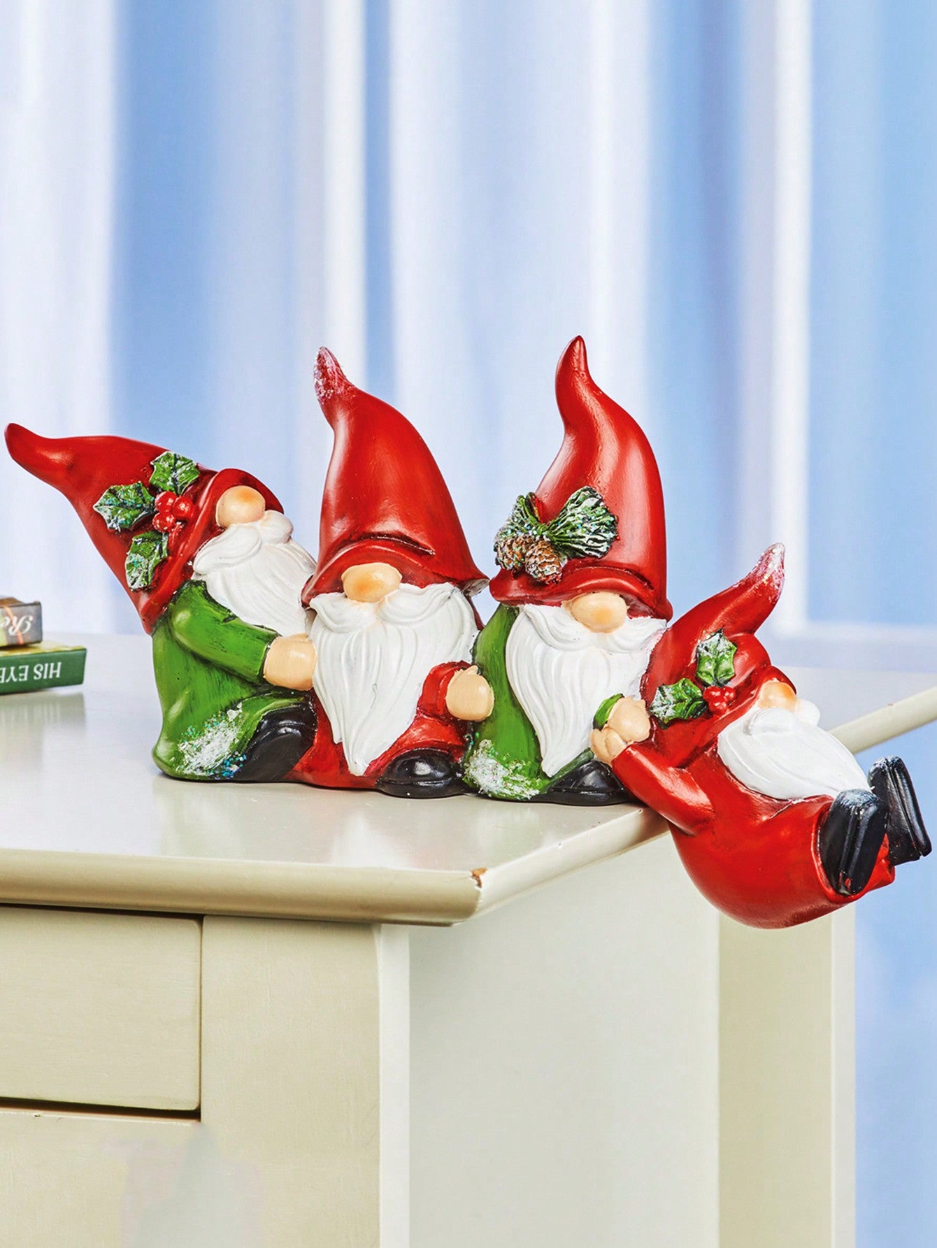 Add a touch of holiday cheer with our Resin Santa Claus Figurine featuring 4 charming gnome decorations. Handcrafted with resin, this perfect party ornament adds a festive touch to any space. Bring joy and delight to your home this holiday season.