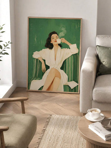 Large framed green portrait print leaning against living room wall beside beige sofa and coffee table