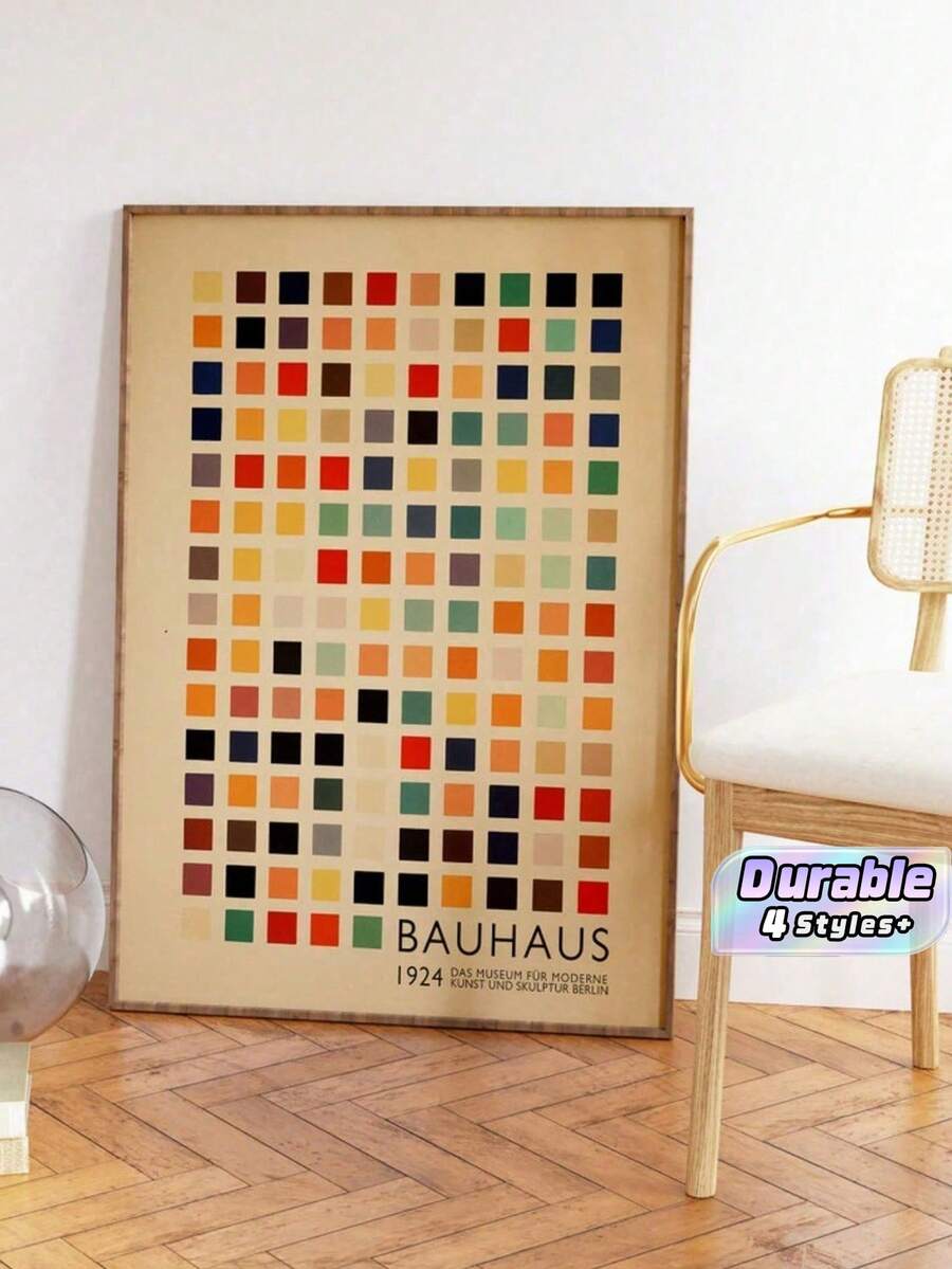 Retro Bauhaus geometric canvas poster with muted color blocks in a framed living room display
