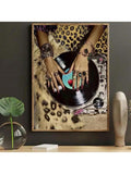 Framed display mockup showing glam vinyl record turntable canvas print with jeweled hands and leopard print background