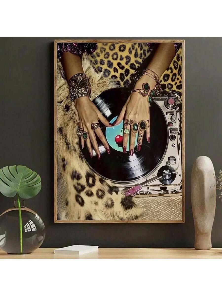 Framed display mockup showing glam vinyl record turntable canvas print with jeweled hands and leopard print background