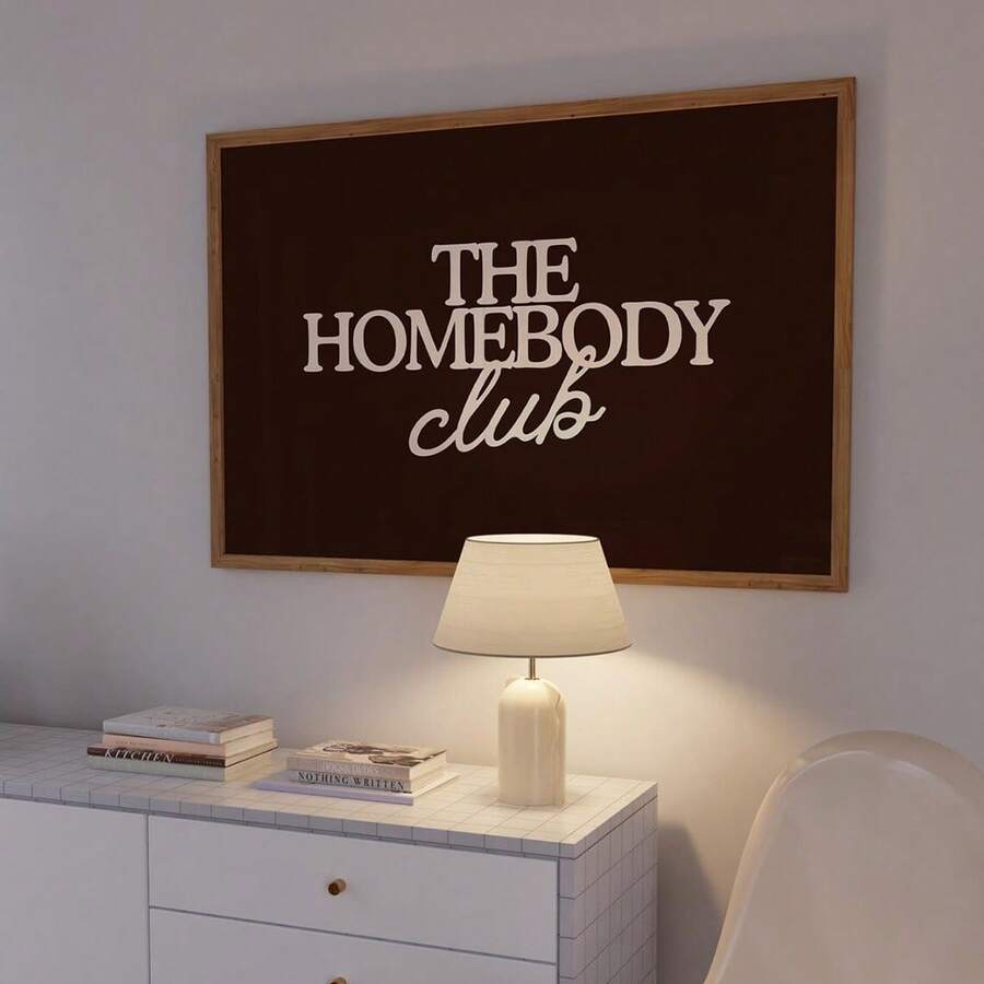 Embrace the art of doing nothing with this retro "Homebody Club" canvas poster. Featuring minimalist vintage-inspired design in warm redwood tones, this graphic piece celebrates the joy of staying cozy at home. Perfect for living rooms, bedrooms, or any space that needs a touch of nostalgic charm, it's an ideal gift for anyone who values comfort and style. The canvas material ensures durability while maintaining that classic aesthetic appeal.
