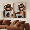 Paired STYLE magazine portraits displayed above a plush brown sectional sofa