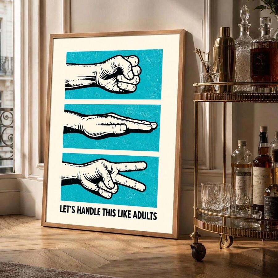 Framed turquoise rock paper scissors quote poster beside a bar cart