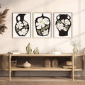 Botanical flower vase wall art with olive leaves and light wood frame