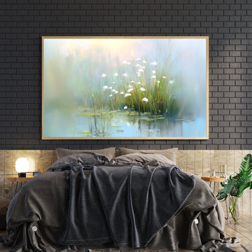 Bring tranquility into your space with this captivating canvas wall art featuring a serene lakeside landscape adorned with delicate white flowers. The soft, naturalistic composition creates a calming focal point perfect for living rooms, bedrooms, or any area needing visual respite. High-quality canvas construction ensures durability and vibrant color retention, while the versatile nature-inspired design complements both contemporary and traditional interiors.