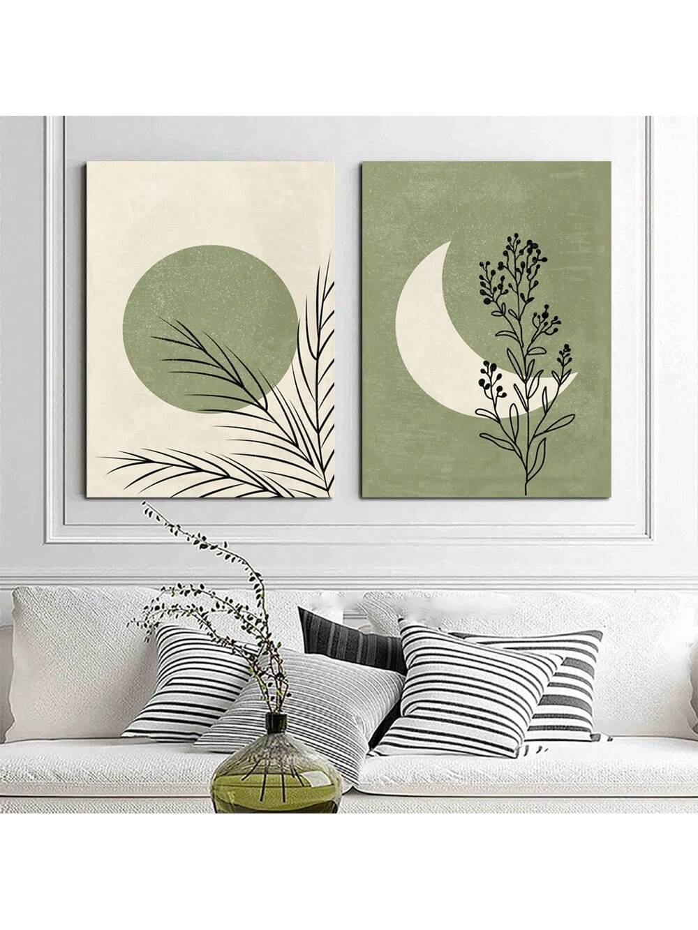 Elevate your home decor with this set of 2 retro moon and leaf canvas prints. Featuring a creamy white and sage green color palette, these elegant art pieces are sure to add a touch of sophistication to any room. Perfect for lovers of vintage-inspired decor.