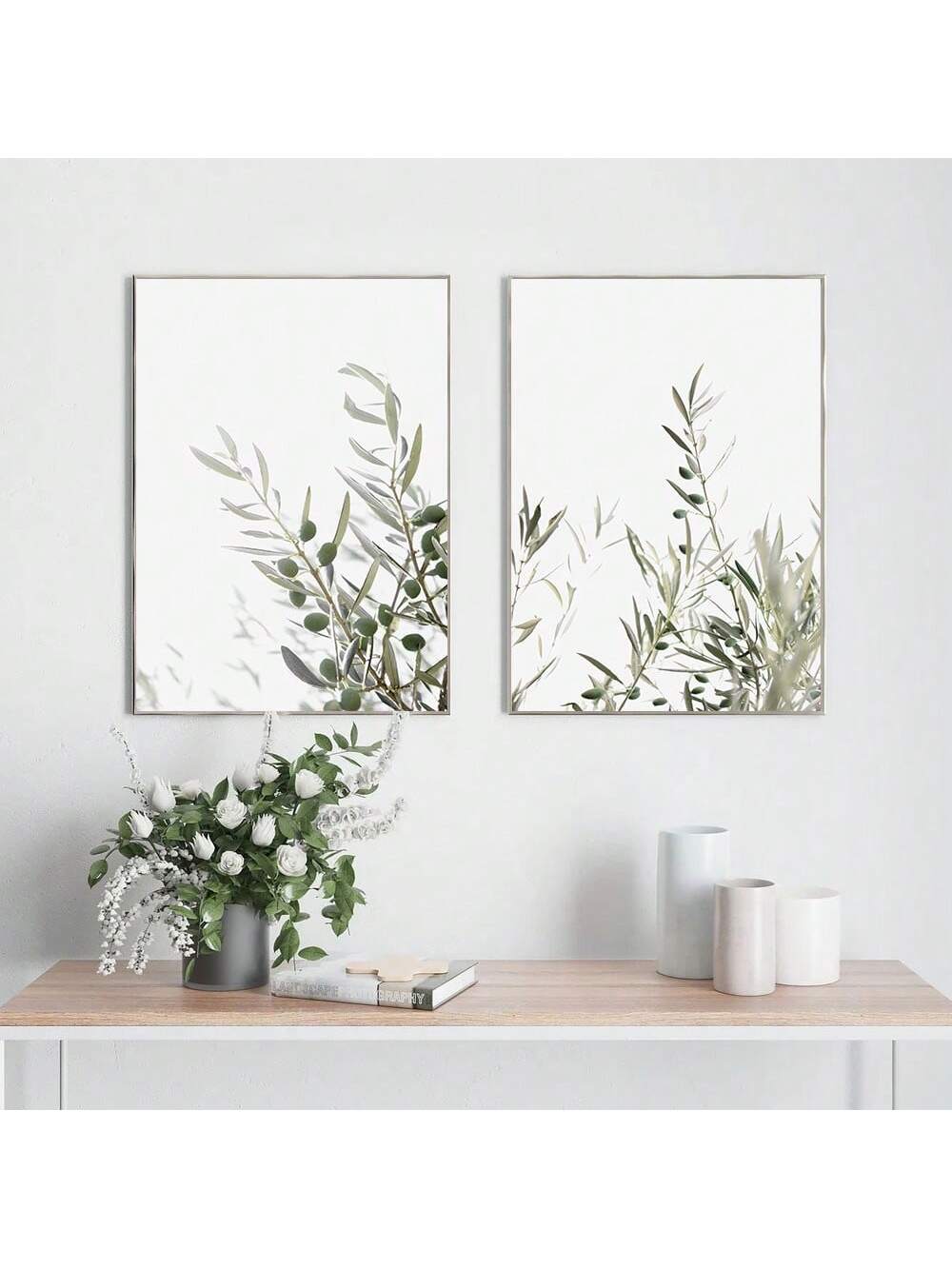 Transform your space with this set of 2 unframed olive branch wall art posters. These sophisticated botanical canvas prints feature delicate olive branch imagery that perfectly complements minimalist coastal home décor. The neutral palette and organic design elements create a serene atmosphere while adding refined visual interest to any room. Ideal for creating a cohesive gallery wall or as standalone statement pieces in entryways, living rooms, or bedrooms.