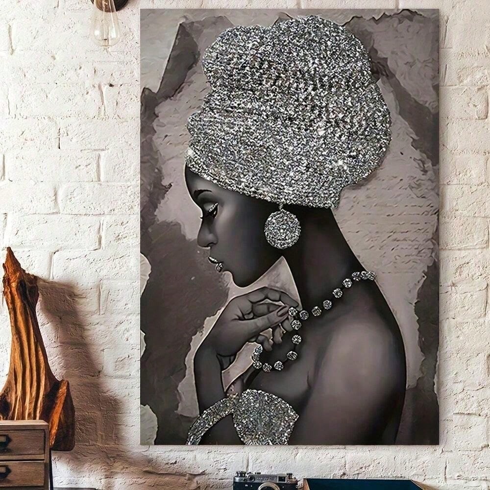 Featuring a stunning silver African woman, this framed abstract canvas painting is the perfect addition to any home wall decor. With its unique and eye-catching design, this piece is sure to add a touch of elegance and culture to any room. Made with high-quality materials, it is built to last and impress.