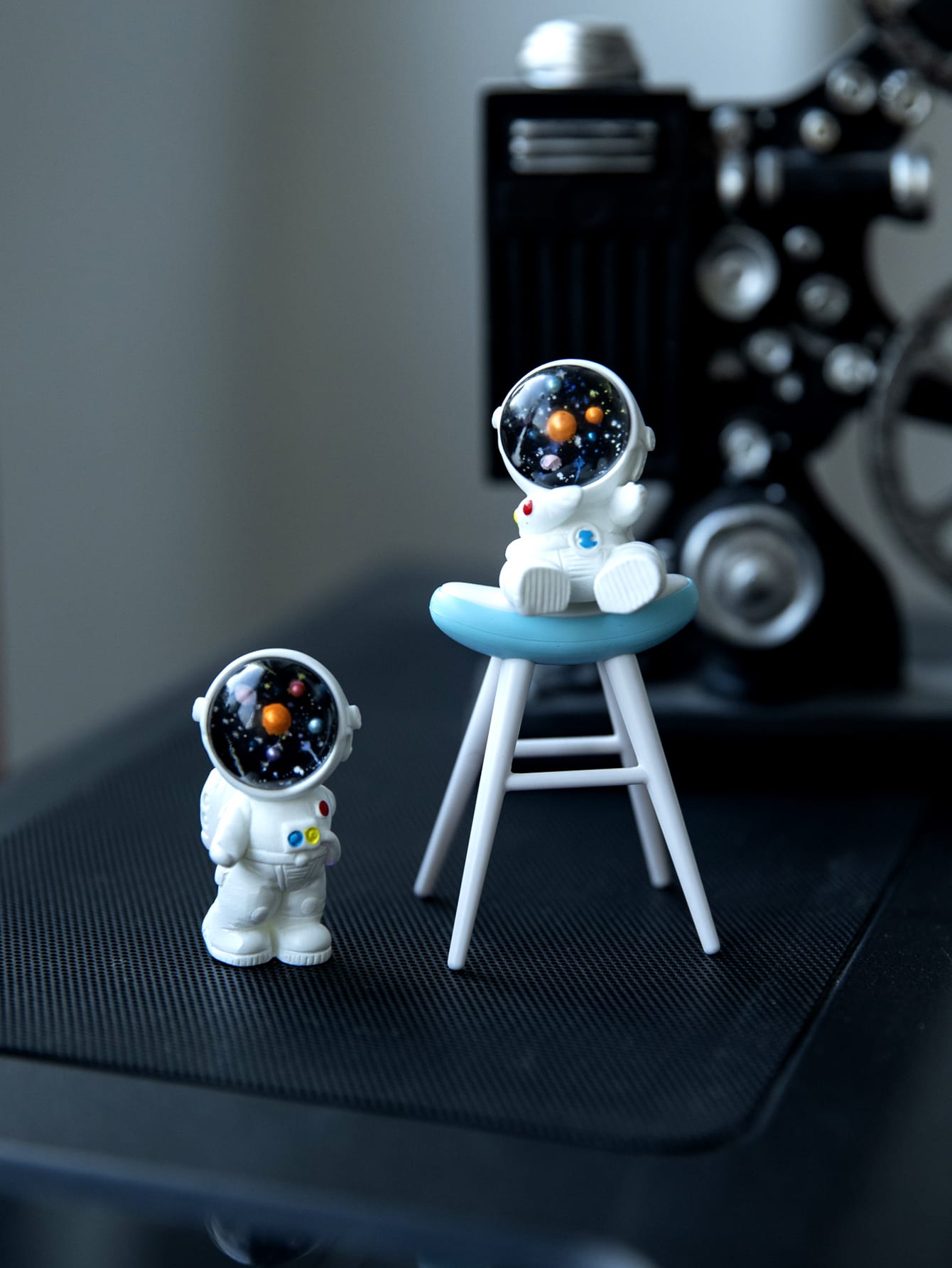 This Space Age Chic 3-piece Astronaut Ornament Set is a must-have for any space enthusiast. Made with high-quality materials, these unique ornaments are perfect for adding a touch of charm and style to your home or office decor. Display them proudly and let your love for space shine through.
