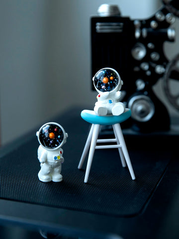 This Space Age Chic 3-piece Astronaut Ornament Set is a must-have for any space enthusiast. Made with high-quality materials, these unique ornaments are perfect for adding a touch of charm and style to your home or office decor. Display them proudly and let your love for space shine through.