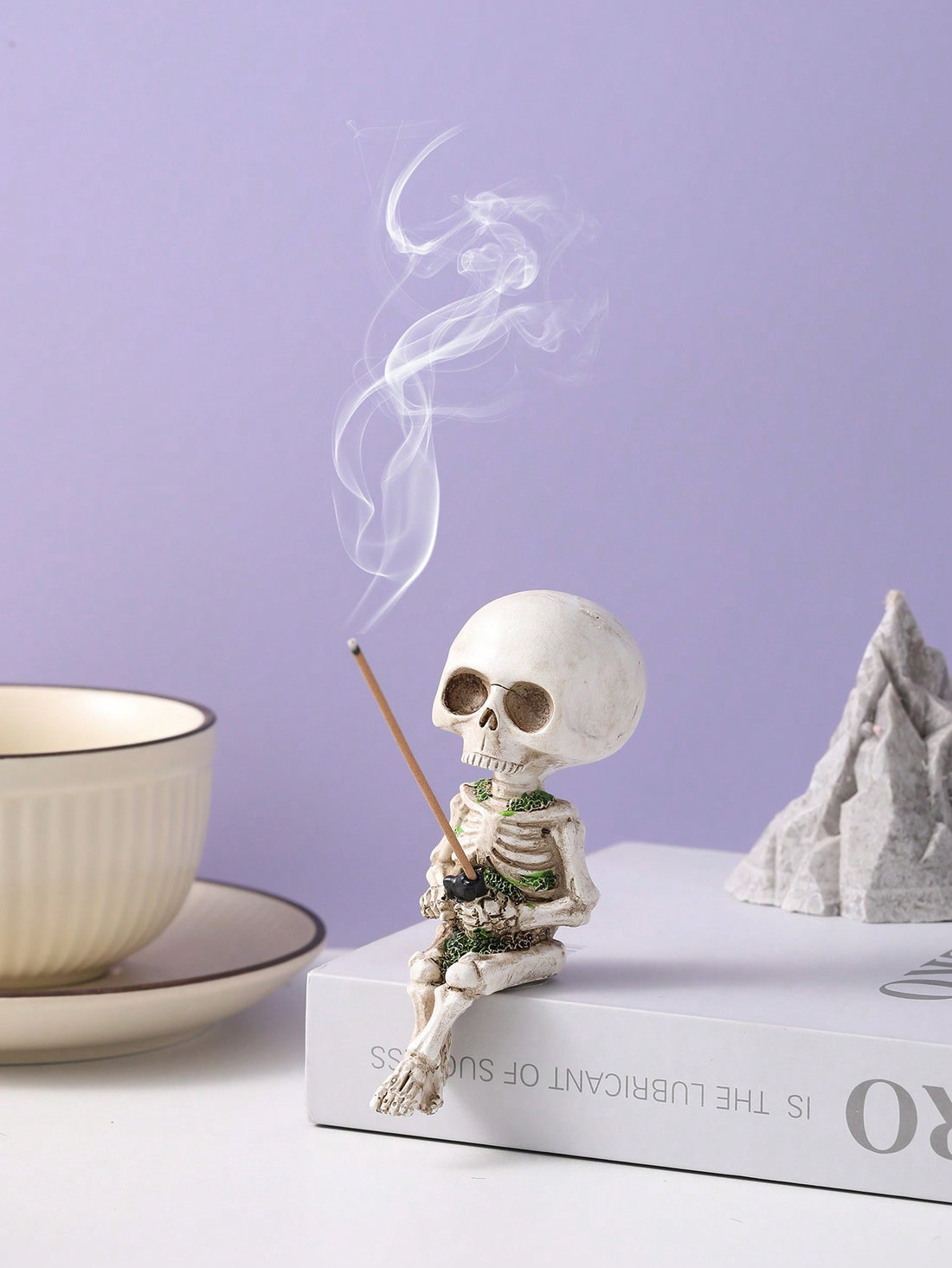 Add a touch of eerie charm to your Halloween and festive decor with our Spooky Charm Skull Ghost Incense Burner. Made from high-quality resin, it features intricate details and a creative design that is sure to impress. Perfect for burning your favorite incense, this burner will create a spooky yet inviting atmosphere for any occasion.