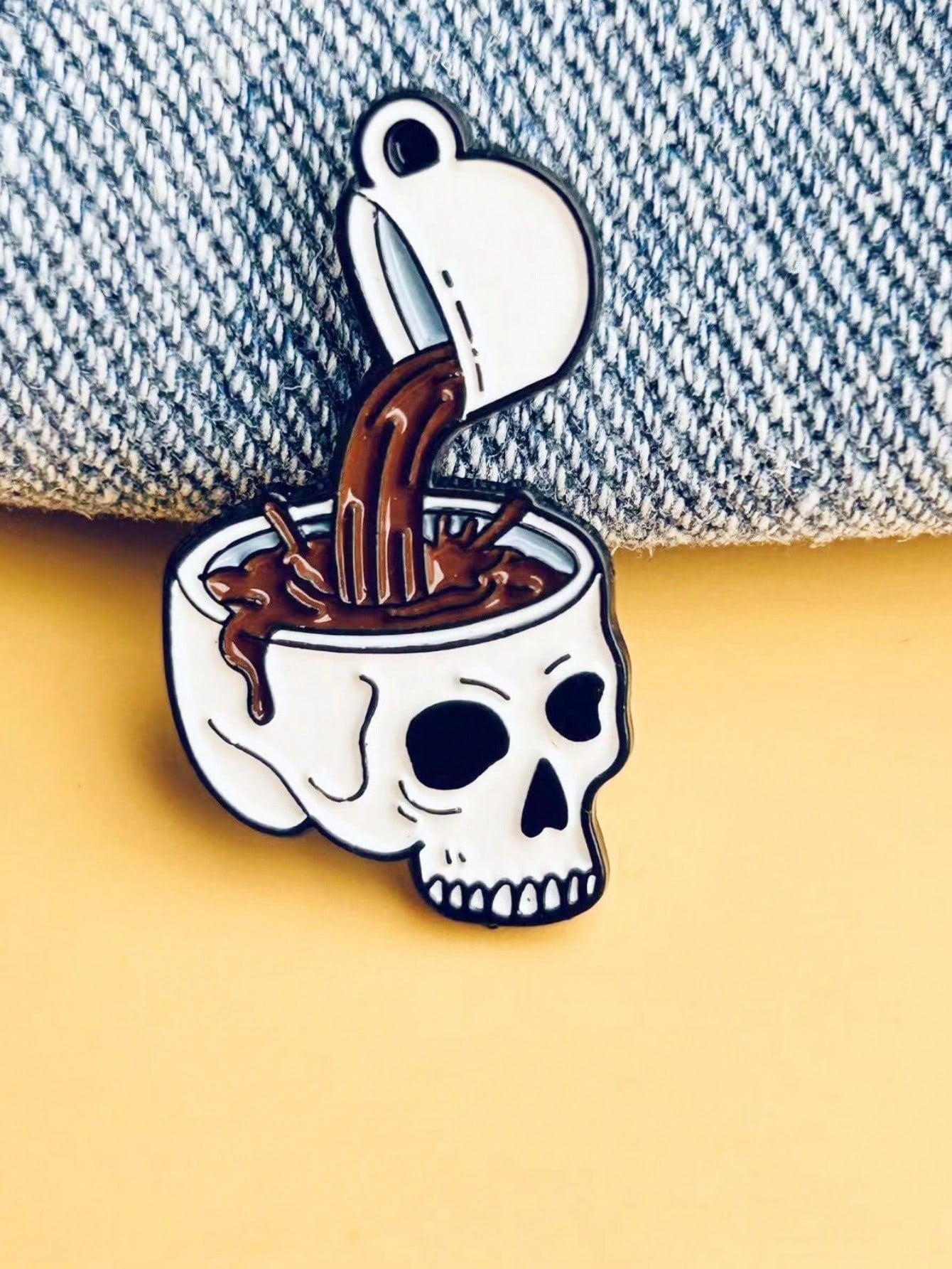Add a touch of spooky chic to your wardrobe with our Skull Coffee Enamel Brooch Pin! This unique accessory is perfect for Halloween festivities and everyday style. Made with high-quality enamel, it's durable and eye-catching. A must-have for any fashion-forward individual.