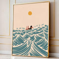 Gold-framed surfing girl ocean wave canvas poster against a paneled wall