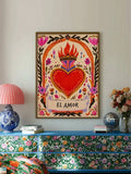 EL AMOR flaming heart folk art above a turquoise floral cabinet with colorful decor