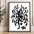 Large black framed Buddhist deity ink poster leaning on wood floor near plant