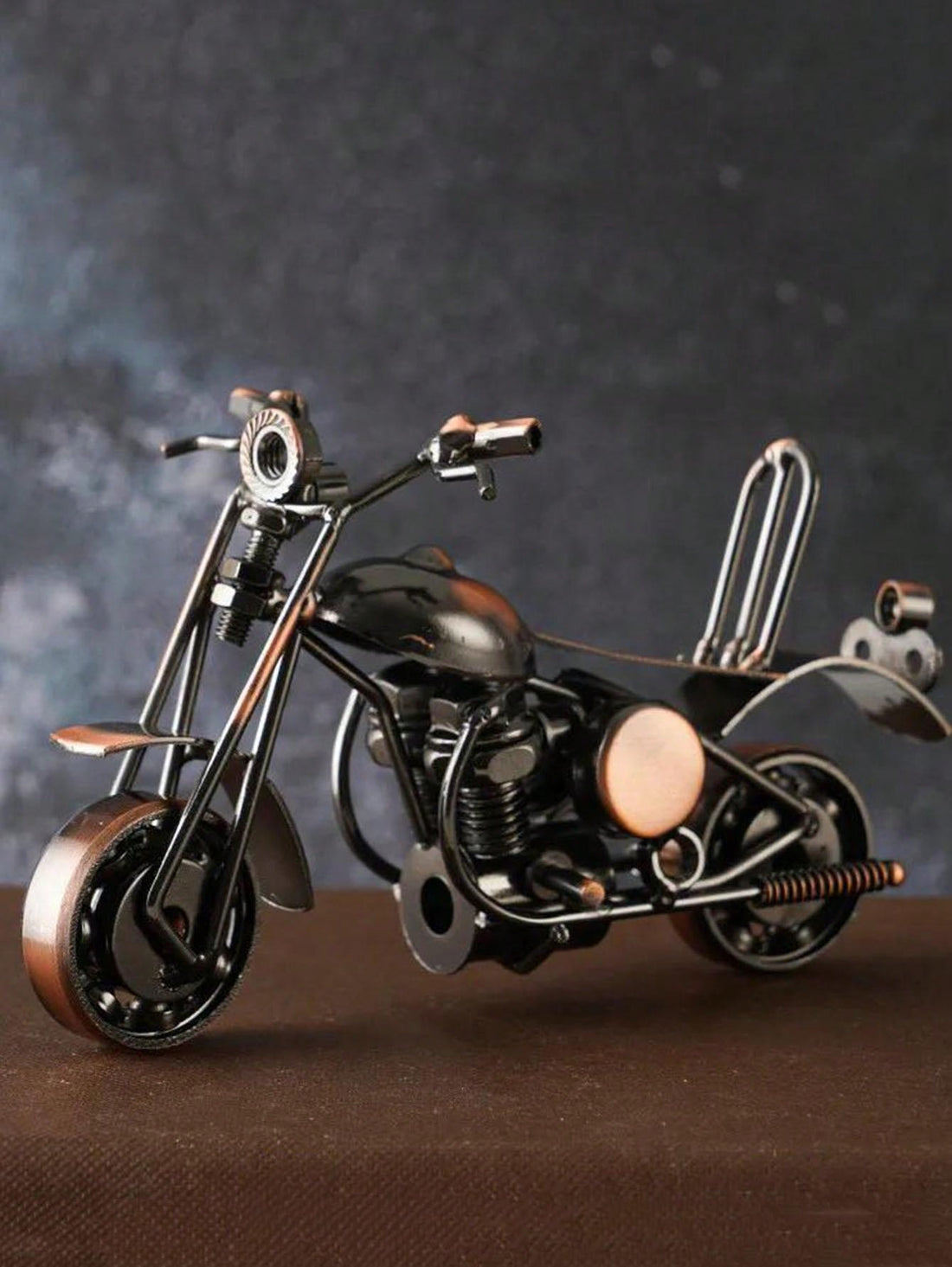 Introducing the Timeless Classic Motorcycle Statue, a perfect addition to any room. With its retro fashion and nostalgic design, it brings a touch of vintage charm to your space. Made with attention to detail, it's a must-have for any motorcycle enthusiast.