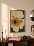 Framed cream iris bloom with ochre center against dark green canvas above console