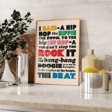 Framed multicolor hip hop lyric canvas styled on a kitchen counter
