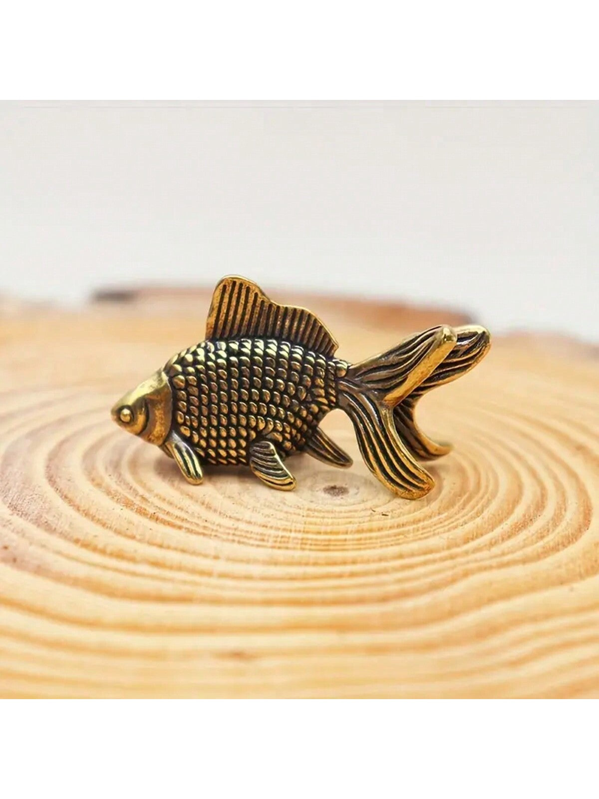 This vintage brass goldfish statue makes a charming addition to any home, bringing with it a sense of luck and good fortune. Crafted with intricate detail and a golden shine, this timeless piece is a symbol of prosperity and grace. Perfect for incorporating into your decor and enhancing the overall ambiance of your living space.